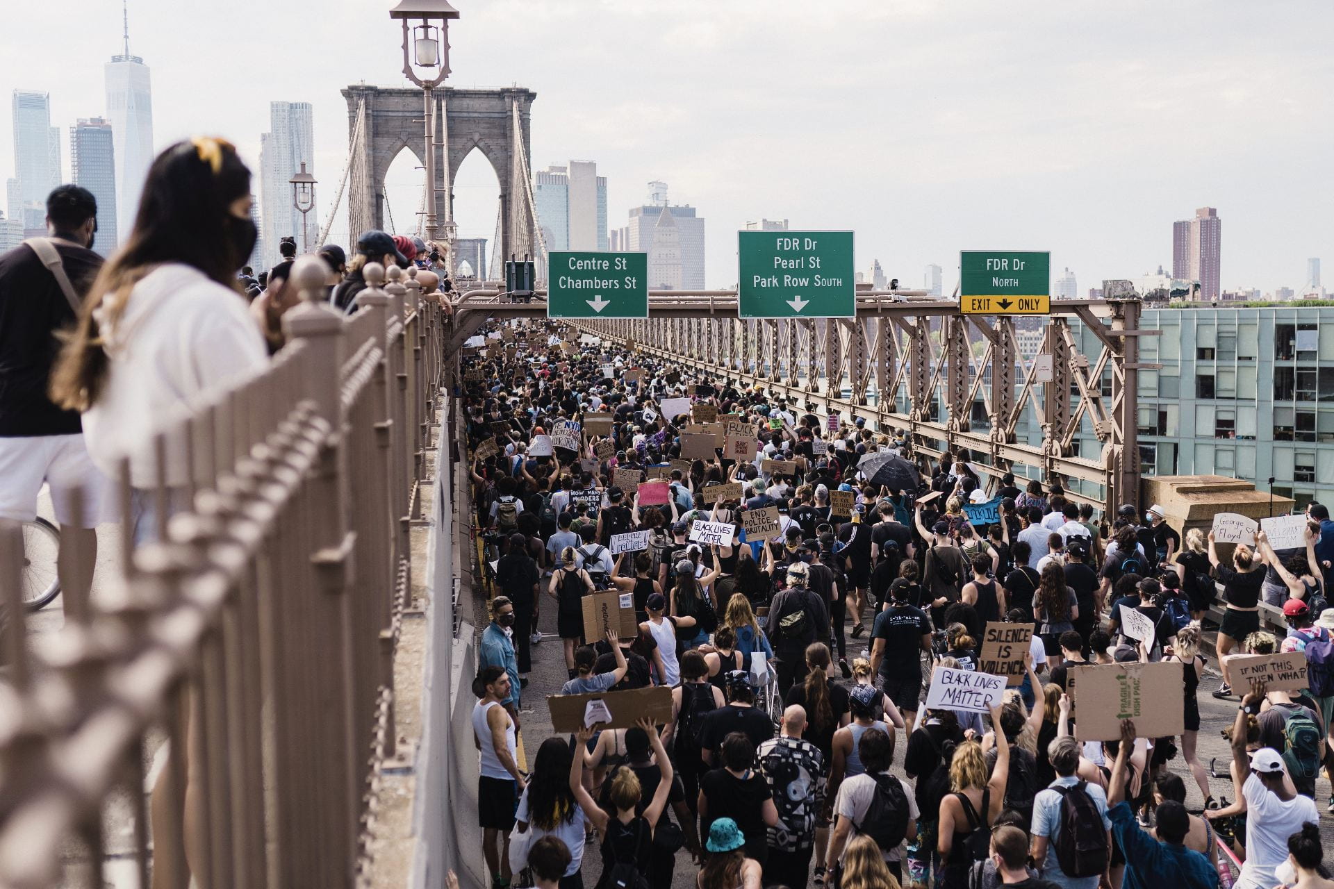 Black Lives Matter Movement protest on the Brooklynn Bridge. Photo shows the bridge full of people holding signs to protest.