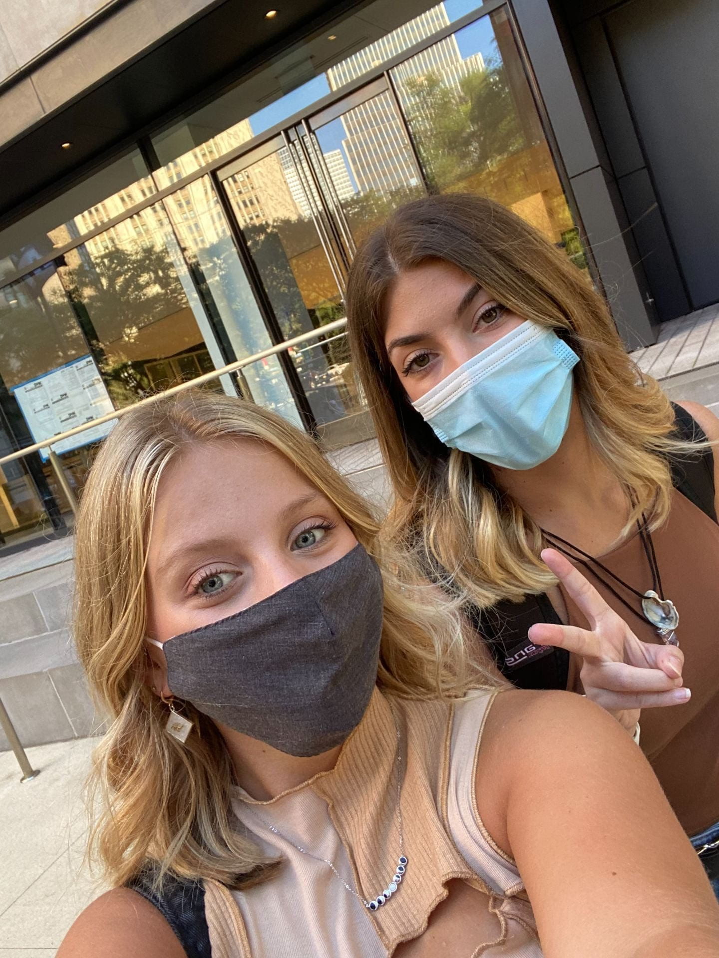 Madison and Marissa outside of 1 Pace Plaza wearing masks